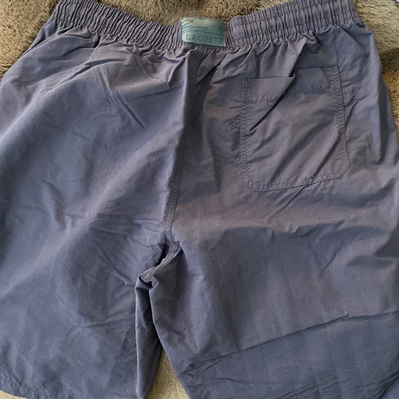 A Lacoste men’s quick-dry swim shorts with built in mesh lining. - Picture 6 of 8